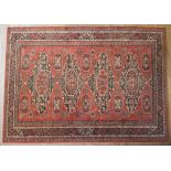 A Royal Keshan Soumac wool rug.