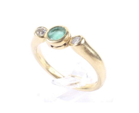 A vintage 18ct gold, emerald and diamond three stone ring, Centred with a round mixed-cut emerald between round brilliant dia