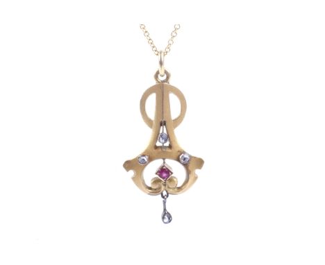 An early 20th century gold, rose diamond and synthetic ruby openwork pendant. Hung from a fine chain on a trigger clasp stamp