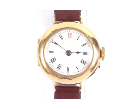 A lady's 18ct gold cased wrist watch, circa 1906(?). The white enamel dial with a red 12 and black Roman numerals, the 25.5mm