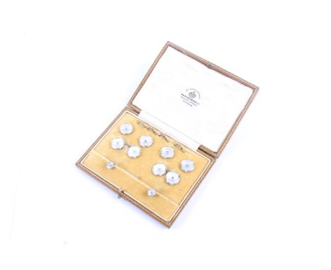 An early 20th century gold, mother of pearl and diamond octagonal dress set. Comprising; a pair of twin-panel cufflinks with 