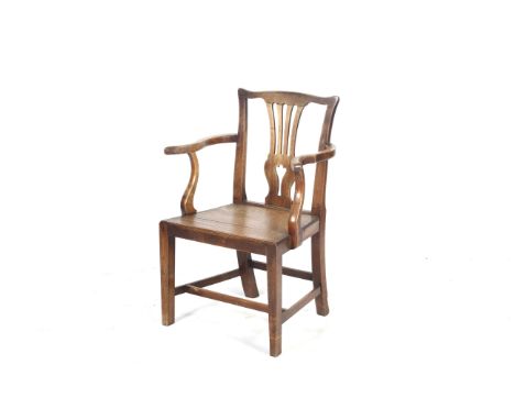 A Georgian mahogany chippendale style armchair. With pierced slats and a solid seat, raised on square tapered supports, H91cm