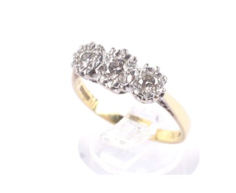 A vintage 18ct gold and diamond three stone illusion ring. The three slightly-graduated round brilliants approx. 0.33cts tota