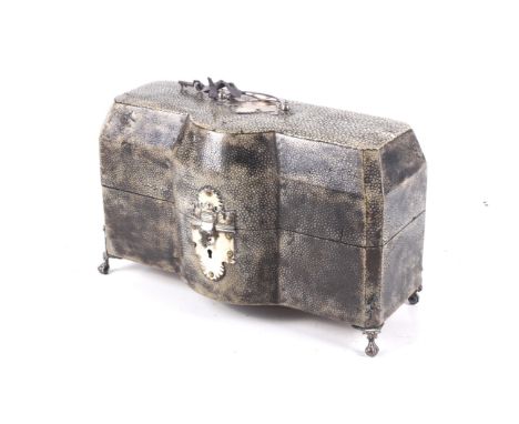 A George III silver mounted shagreen tea caddy case. Of canted-rectangular outline with a shaped 'break front', the hinged li