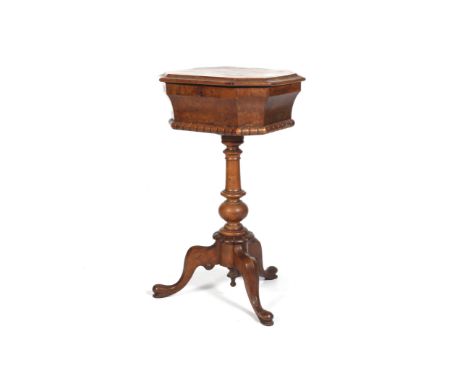 A Victorian mahogany tea boy. Of octagonal form, the hinged lid hinged revealing two octagonal lidded tea containers, raised 