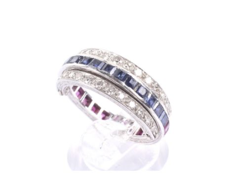 A mid 20th century platinum, ruby, sapphire and diamond 'Night and Day' hinged eternity ring. The central 3mm wide band calib