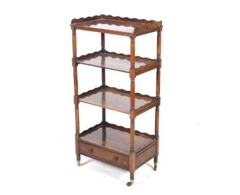 An early 19th century rosewood three tier buffet. The rectangular shelves with turned supports and a single drawer to the bas