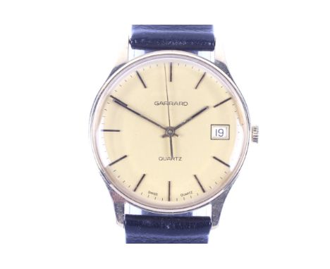 Garrard, a gentleman's 9ct gold round quartz wrist watch, circa 1982. The champagne dial with raised gilt baton indicators an