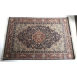 A blue ground rug with red and cream details.