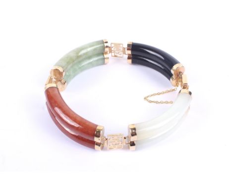A Chinese jadeite and hardstone panel bracelet. Designed as a series of vari-coloured hardstone arched-cylindrical links with