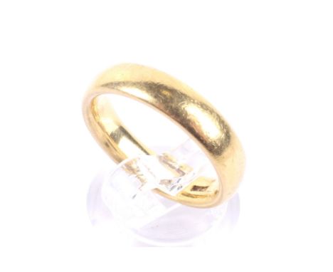 A vintage 22ct gold court-section wedding band. Hallmarks obscured probably Birmingham 1970, 4.6mm wide, size leading edge P 