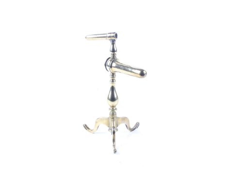 A 19th century turned brass double goffering (tally) iron. On a tripod base, H29cm