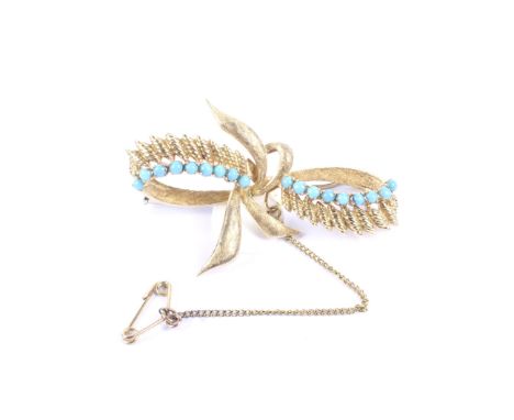 A vintage Italian gold and turquoise brooch in the form of a stylised textured-leaf ribbon-tied bow. Stamped '237aI', 'ITALY'