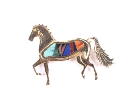 A vintage American '14K' and intarsia set horse brooch. Modelled in a prancing pose and set with a shaped panel of hardstones