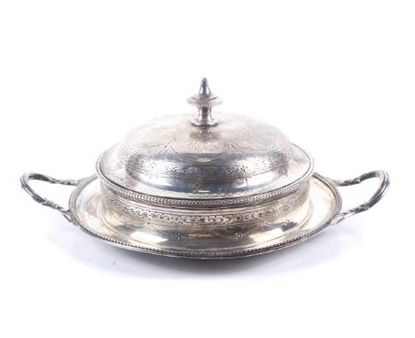 A Victorian silver round butter dish and cover. With a star-cut clear-glass dish, the base with beaded borders, two leaf-chas