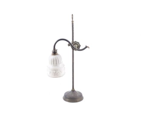 An early 20th century brass electric table lamp. On a twist column and circular support, the adjustable branch fitted with a 