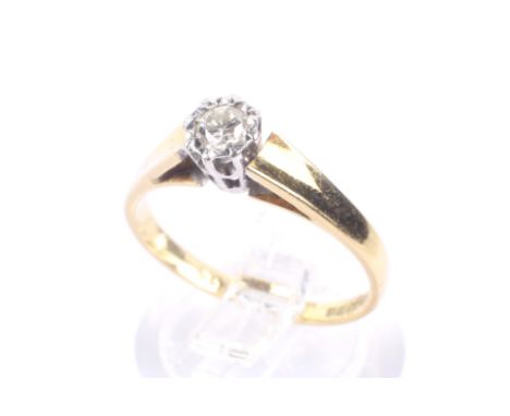 A vintage 18ct gold and diamond solitaire illusion ring. The round brilliat approx. 0.10cts grain-set within a white star-sha