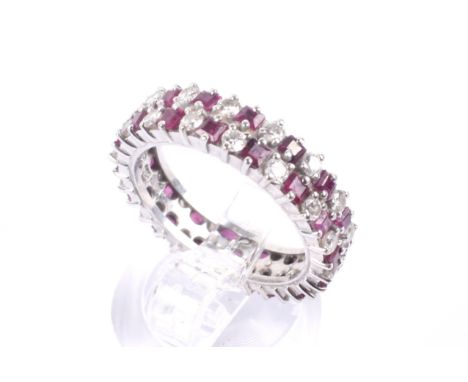 A modern ruby and diamond two-row eternity ring, Alternately set with small round brilliant diamonds and square step-cut rubi