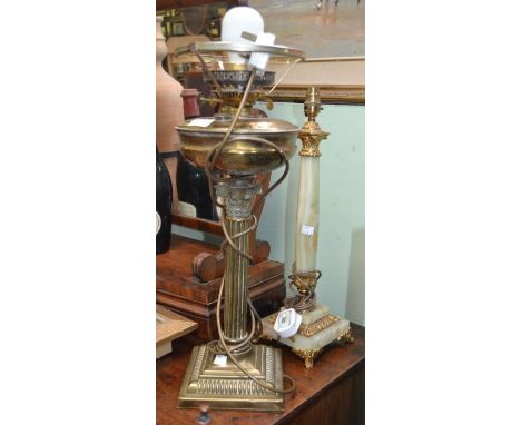 A brass column design table lamp with another onyx example