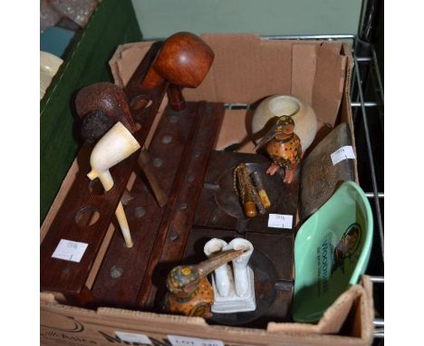 A box containing a selection of pipe smoking and other related items&nbsp;