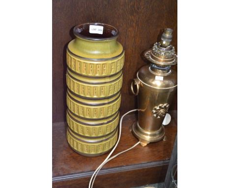 A brass oil lamp converted to electric and a tall cylindrical vase