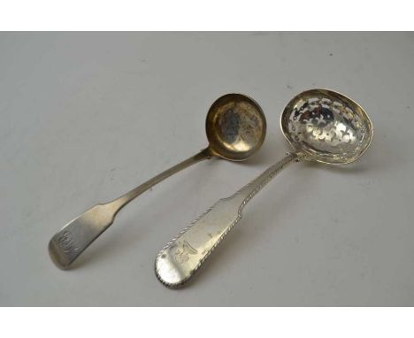 A Georgian silver pierced fiddle pattern handled sifter ladle, bearing a crest together with a Scottish Provincial ladle, com