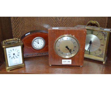 A carriage clock with three mantle clocks (4)