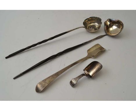 A Georgian silver caddy spoon, a Victorian Britannia standard Stilton scoop, and two twisted whale bone handled Toddy ladles