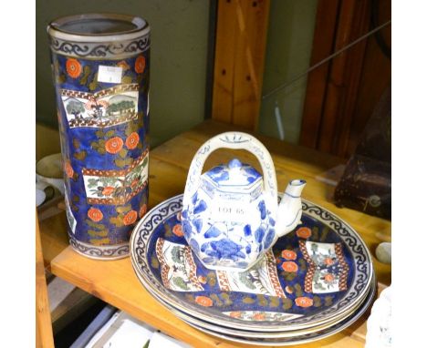 Three Chinese dinner plates, a cylindrical vase and a teapot