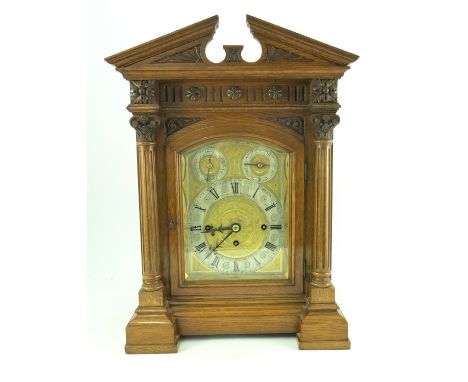 John Hall &amp; Co, Manchester, a late Victorian light oak bracket clock, circa 1890, the case of Baroque design with broken 