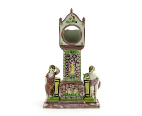 A Dixon &amp; Austin Sunderland pink lustre watch stand, circa 1820, in the form of a longcase clock flanked by a classically