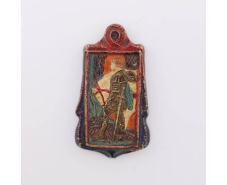 A Compton Pottery pendant, of cartouche form, depicting St George in relief, polychrome decorated with a reddish brown border