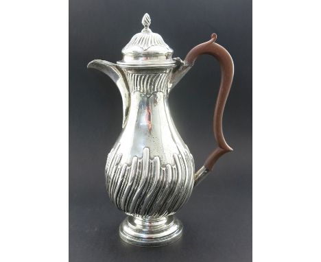 A Victorian silver jug, Nathan and Hayes, Chester 1899, footed and lidded baluster form, embossed flame fluting and reeding t