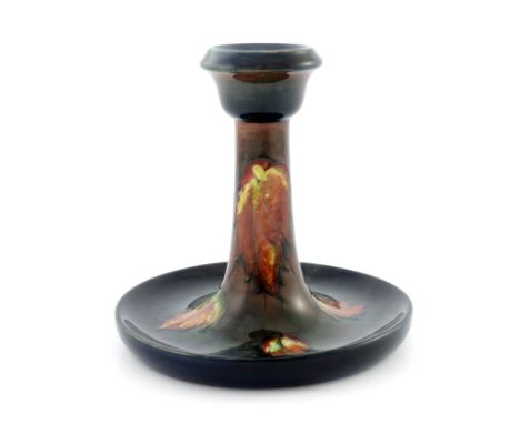 William Moorcroft, a flambe leaf design candlestick, circa 1930, impressed marks and facsimile signature and underglaze blue 