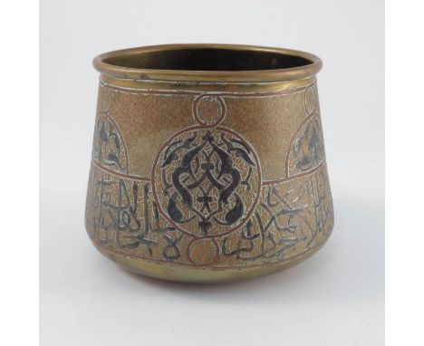 Antique Islamic middle eastern basin, possibly Persian or Ottoman, conical form embossed and painted (black) calligraphy in A