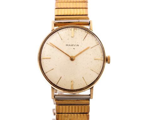 Marvin, a 9ct gold manual wind wrist watch, fitted to a gold plated expandable bracelet, diameter 32mm excluding the crown, t