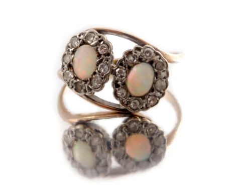 A mid 20th century 9ct gold and platinum, opal cabochon and diamond double cluster ring, stamped 9ct and plat, ring size O, 2