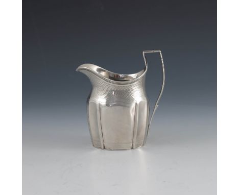 A George III silver jug, Robert and David Hennell, London 1797, fluted Grecian helmet form with bright cut trellis band and b