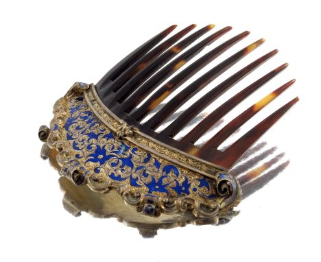 A late 19th century tortoiseshell hair comb, circa 1890, with gilt metal and blue enamel scroll surmount, together with a cor