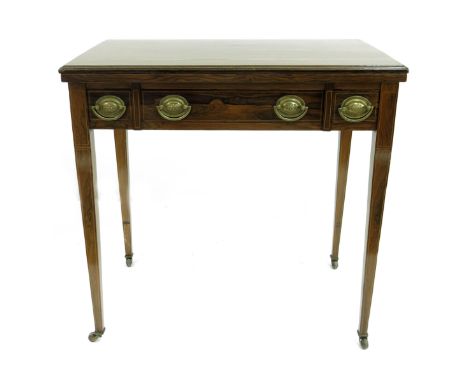 A late Victorian rosewood strung games table, circa 1890, fold-over moulded top with green baize surface, single long frieze 