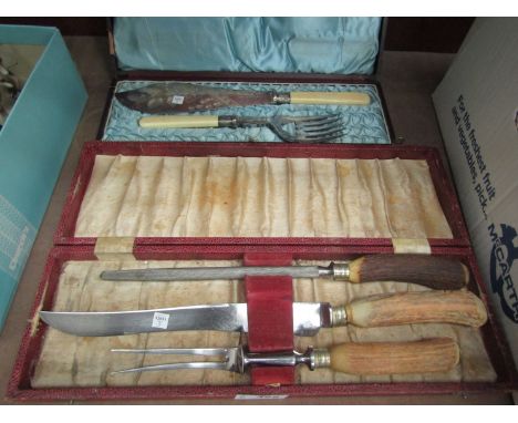 A cased fish knife and fork, and cased bone handled carving set (2)