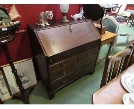 A George III oak bureau the fitted interior with document well over two short and two long drawers with oak linings on bracke