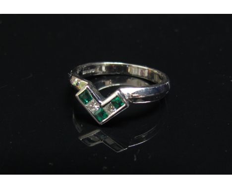 An 18ct white gold square cut emerald and diamond "V" shaped ring. Size M, 3.6g