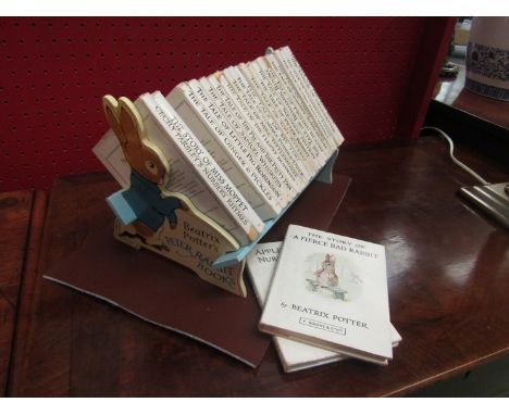 A set of 23 Beatrix Potter books in Beatrix Potter book trough 