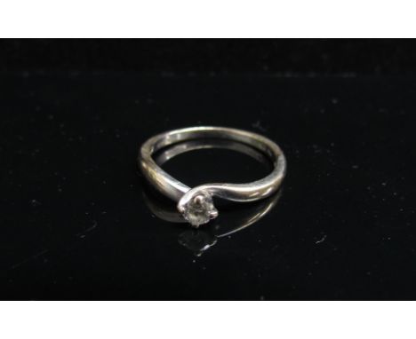 An 18ct white gold diamond solitaire ring, approx. 0.10ct. Size M, 2.1g