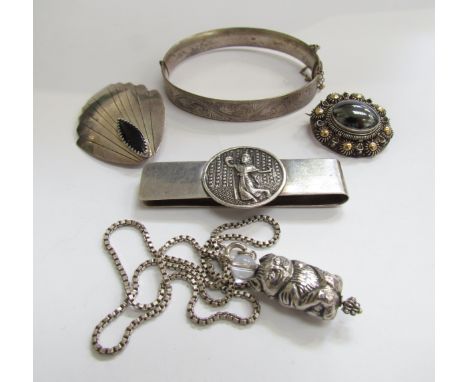 A silver engraved stiff hinge bangle, cat pendant, Siam silver money clip, pendant and brooch 