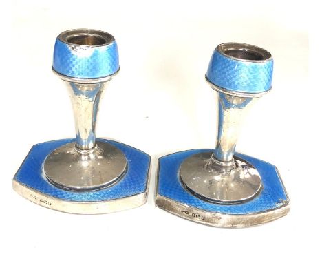 Pair of antique silver and enamel candlesticks measure approx height 9.3cm by 8cm wide filled bases some enamel wear and crea