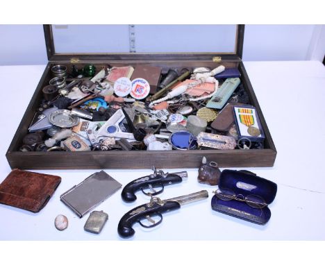 A table top display case with glazed panel and contents of assorted collectables, shipping unavailable 