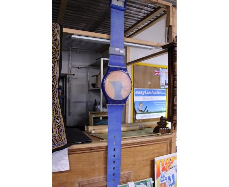 A large Swatch shop display watch (some fading due to sun, strap has wear, works), shipping unavailable 