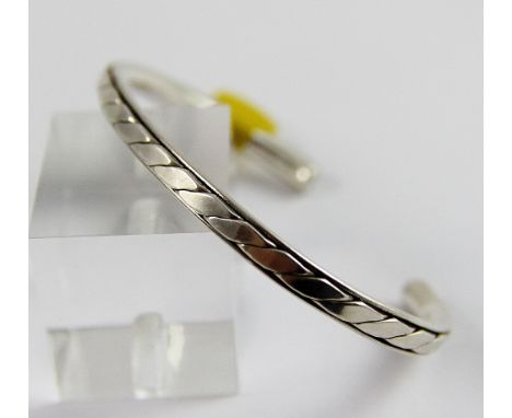 Sterling silver patterned solid torque bangle